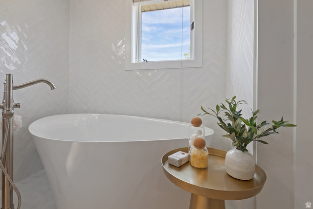 16 Gatehouse Lane Sandy, UT 84092 - Photo 28 of 73 Full bathroom featuring a soaking tub and tile walls