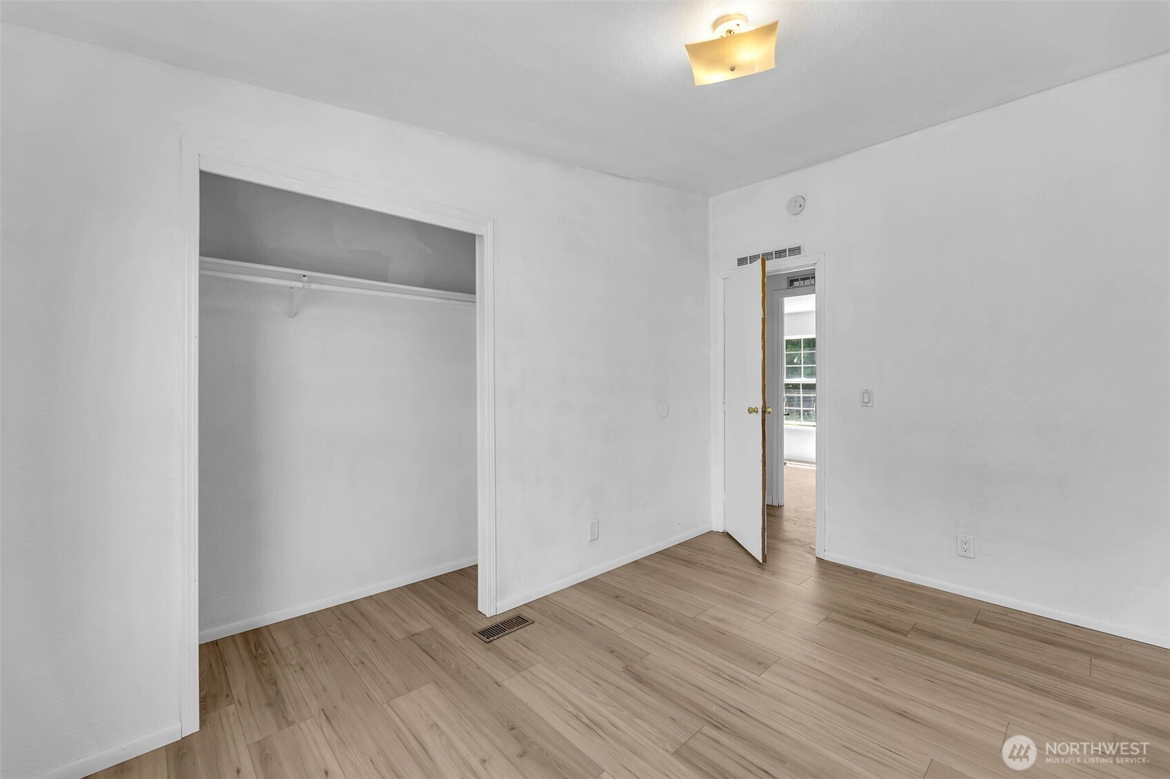241 Foster Creek Road, Unit B Toledo, WA 98591 - Photo 18 of 22 a view of an empty room with wooden floor and a window