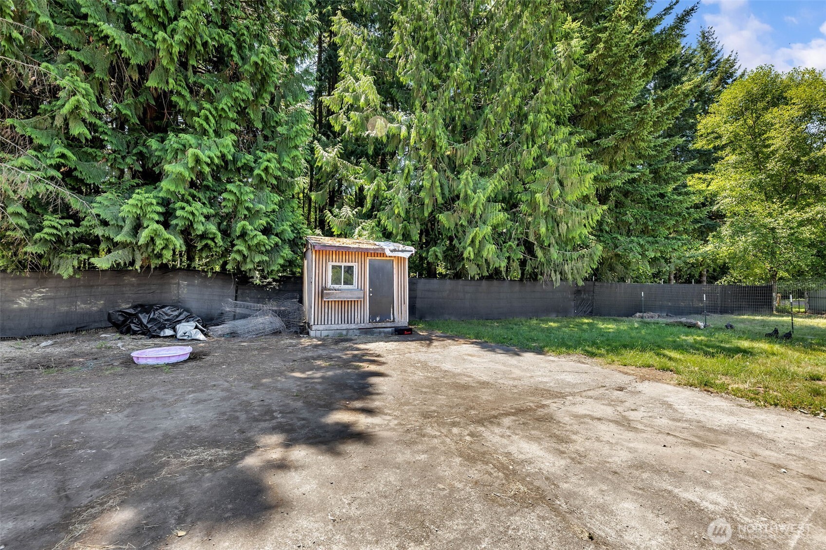 241 Foster Creek Road, Unit B Toledo, WA 98591 - Photo 19 of 22 a backyard of a house with trees and outdoor seating