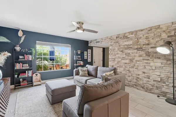 a living room with furniture and a window
