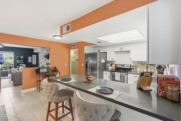 a view of a dining room with furniture and window