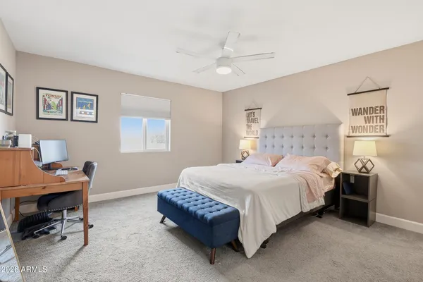 a large kitchen with a table and chairs