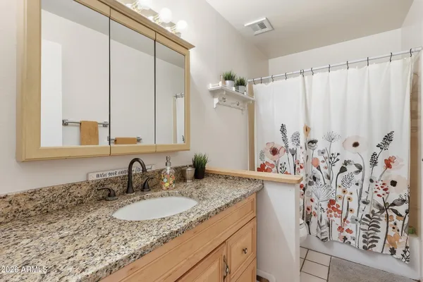 a bedroom with furniture and a window