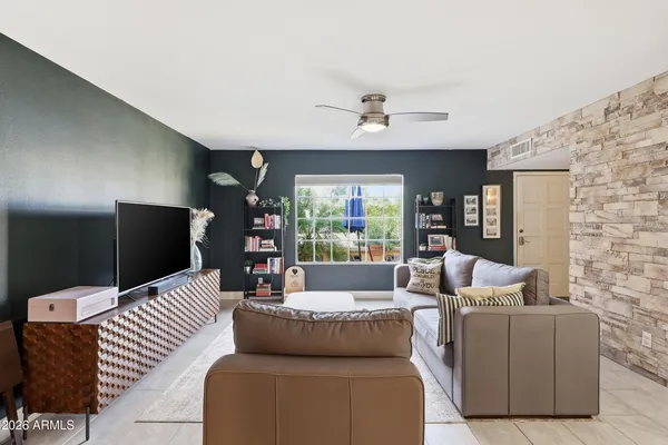 a kitchen with granite countertop a sink stove and refrigerator