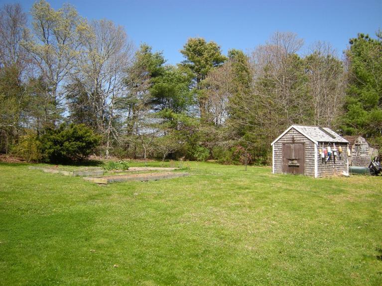 972 River Road Marstons Mills, MA 02648 - Photo 29 of 32 a front view of a house with a yard