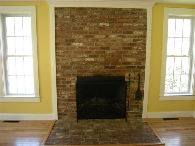 972 River Road Marstons Mills, MA 02648 - Photo 3 of 32 a living room with a fireplace