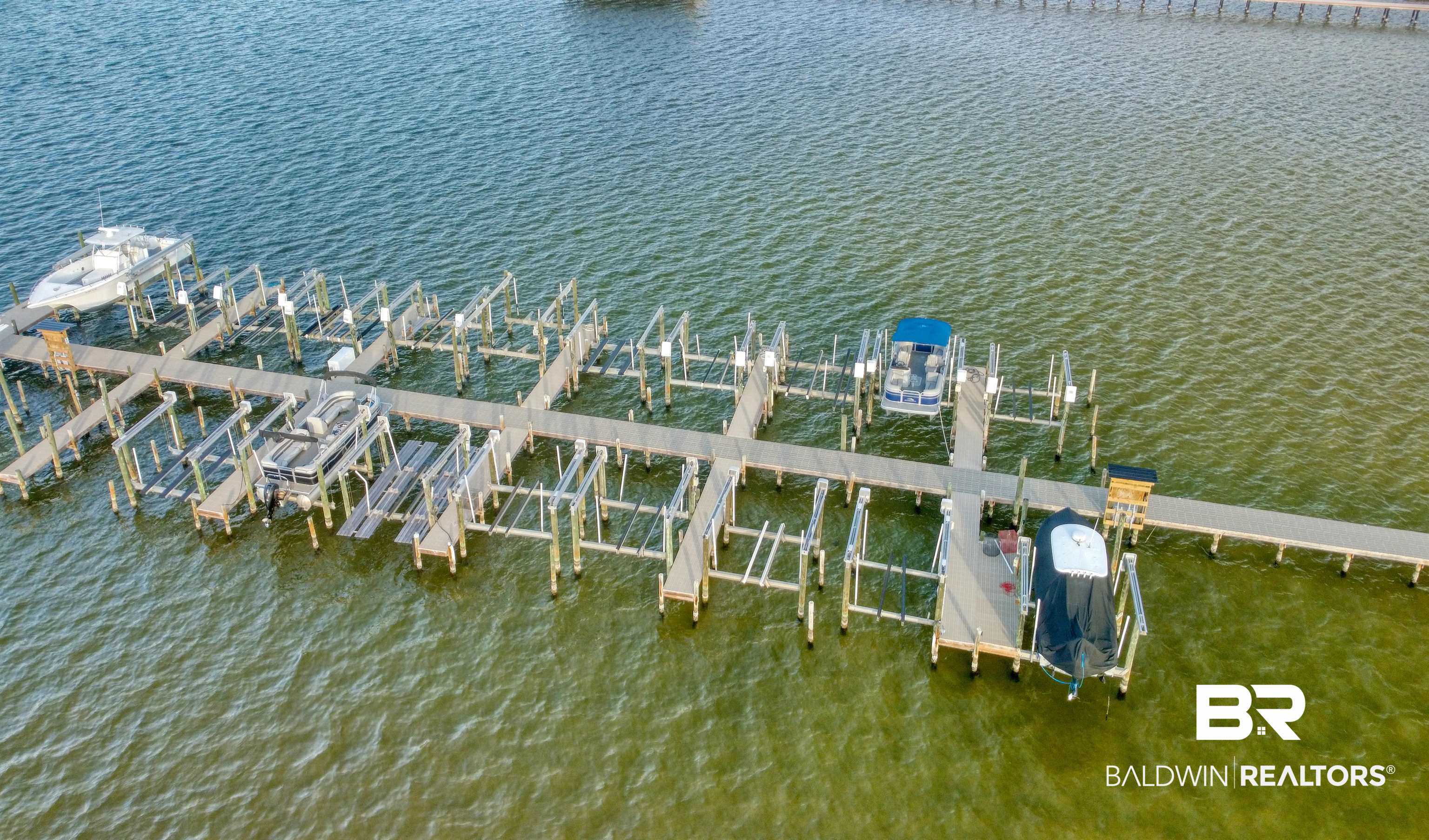 26063 Canal Road, Unit C2 Orange Beach, AL 36561 - Photo 30 of 30 Dock area with boat lift and a water view