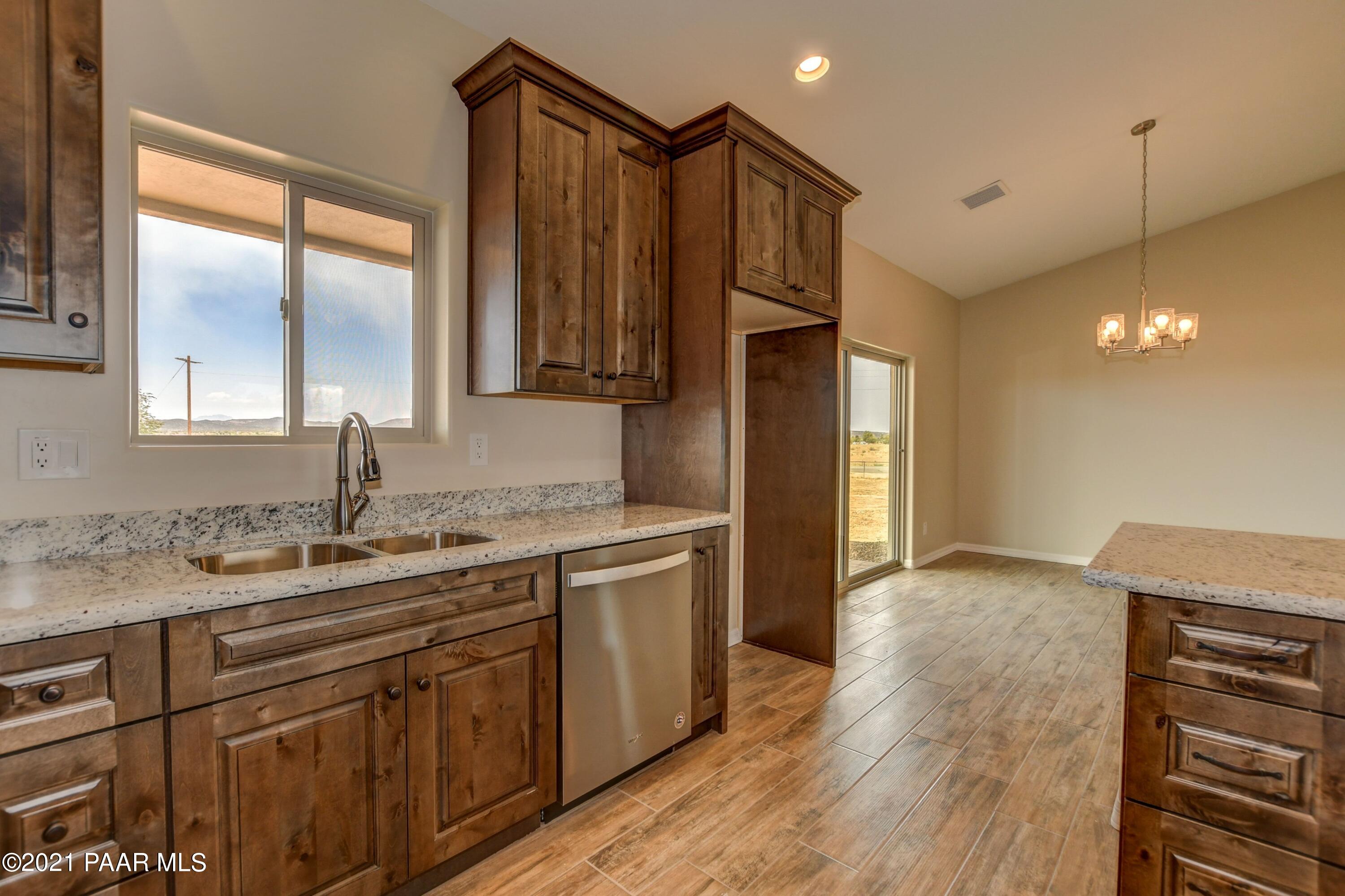1495 Saddle Road Paulden, AZ 86334 - Photo 15 of 33 a kitchen with a sink and cabinets