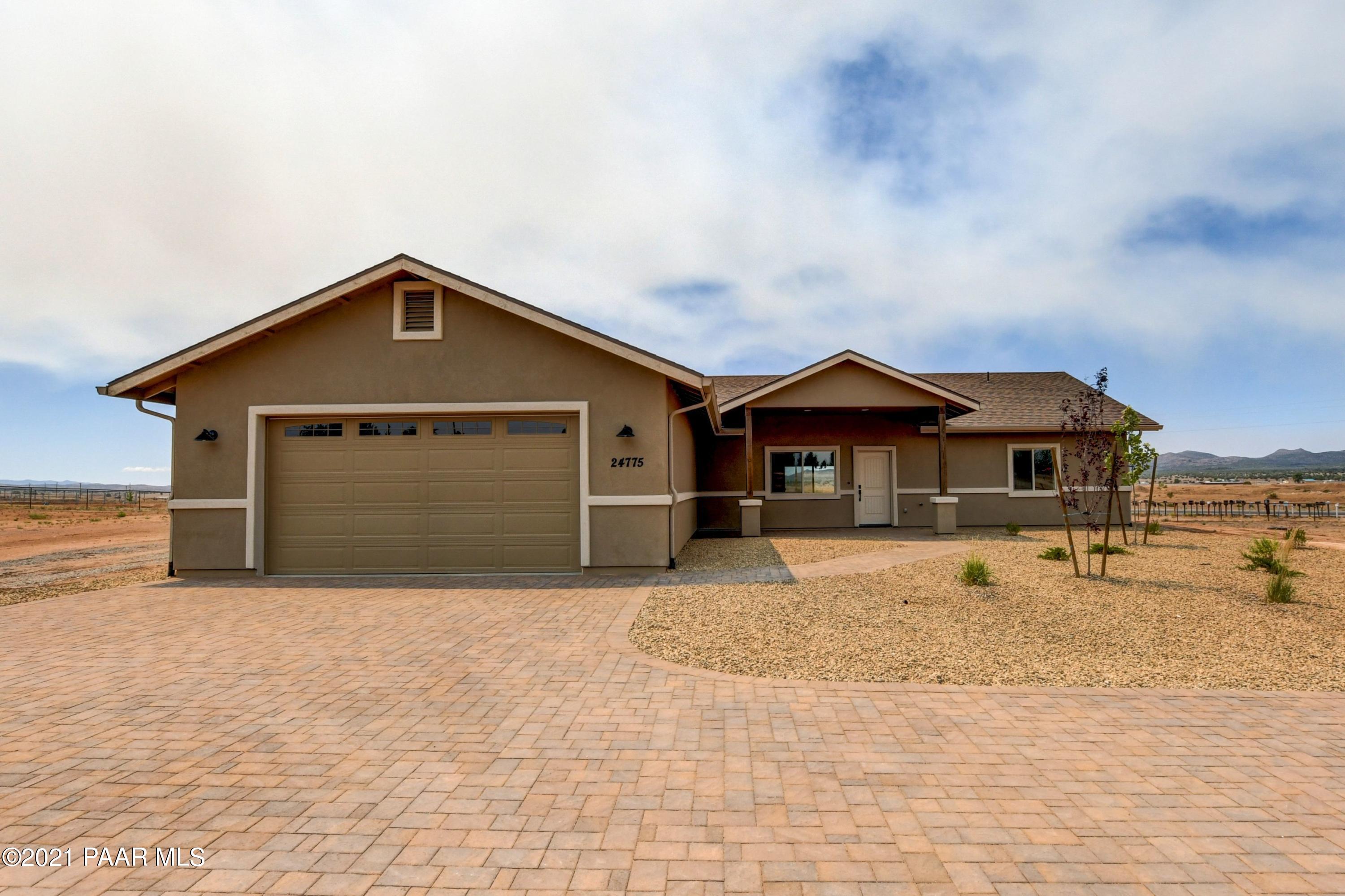 1495 Saddle Road Paulden, AZ 86334 - Photo 10 of 33 a front view of a house with a yard and garage
