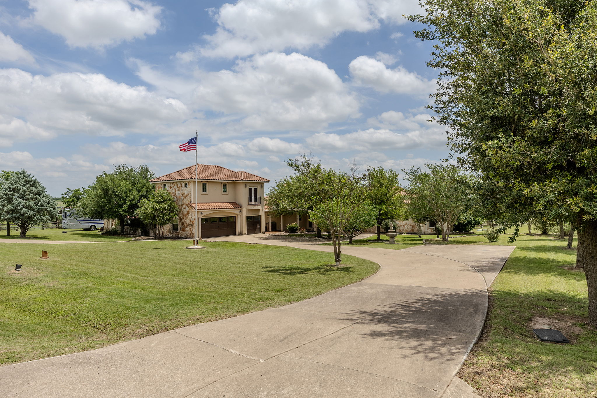 17308 St Therese Road Manor, TX 78653 - Photo 35 of 40 a front view of a house with a yard and trees