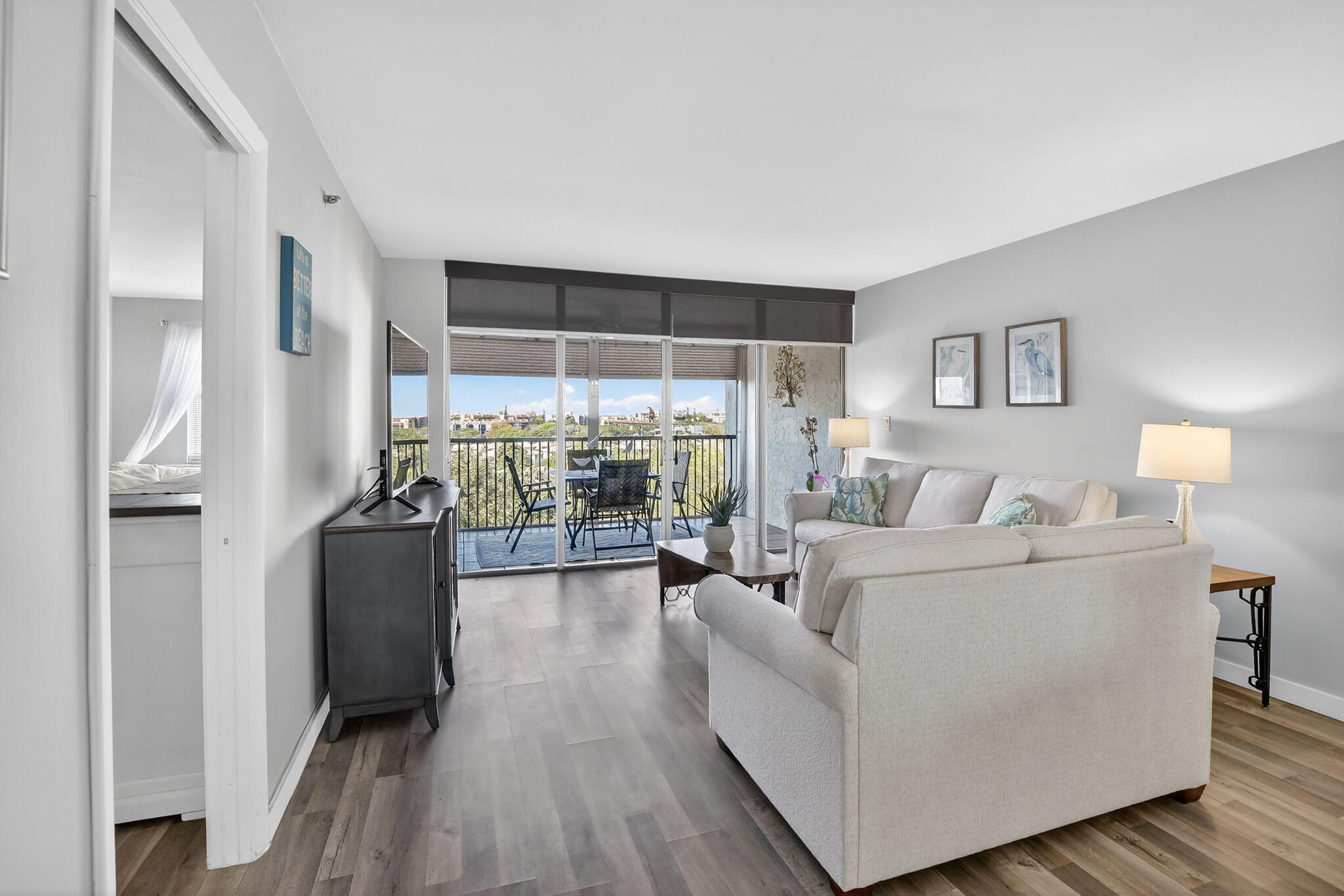 3910 Inverrary Boulevard, Unit 802B Lauderhill, FL 33319 - Photo 14 of 36 a living room with furniture and a large window
