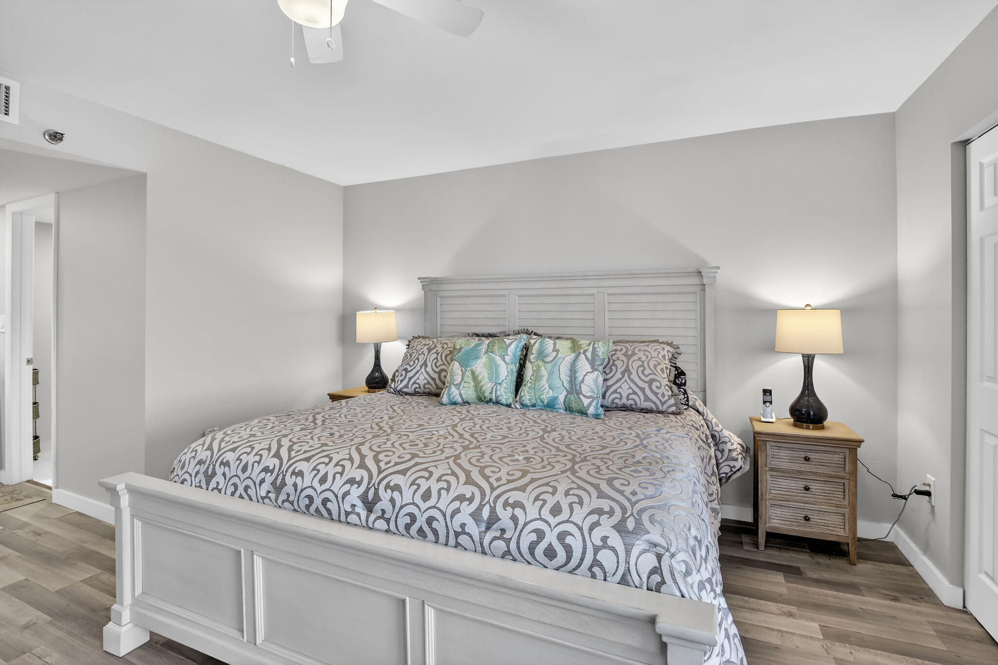 3910 Inverrary Boulevard, Unit 802B Lauderhill, FL 33319 - Photo 16 of 36 a bedroom with a bed and a lamp