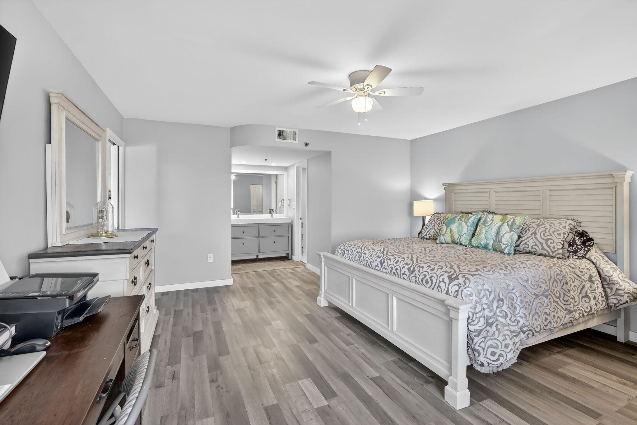 3910 Inverrary Boulevard, Unit 802B Lauderhill, FL 33319 - Photo 17 of 36 a bedroom with a bed and wooden floor