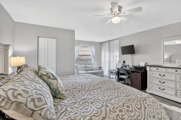 a bedroom with a bed and a dresser