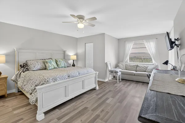 a bedroom with a bed and a couch