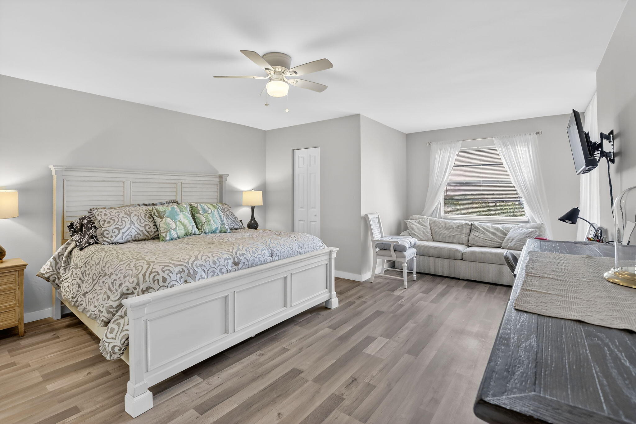 3910 Inverrary Boulevard, Unit 802B Lauderhill, FL 33319 - Photo 19 of 36 a bedroom with a bed and a couch