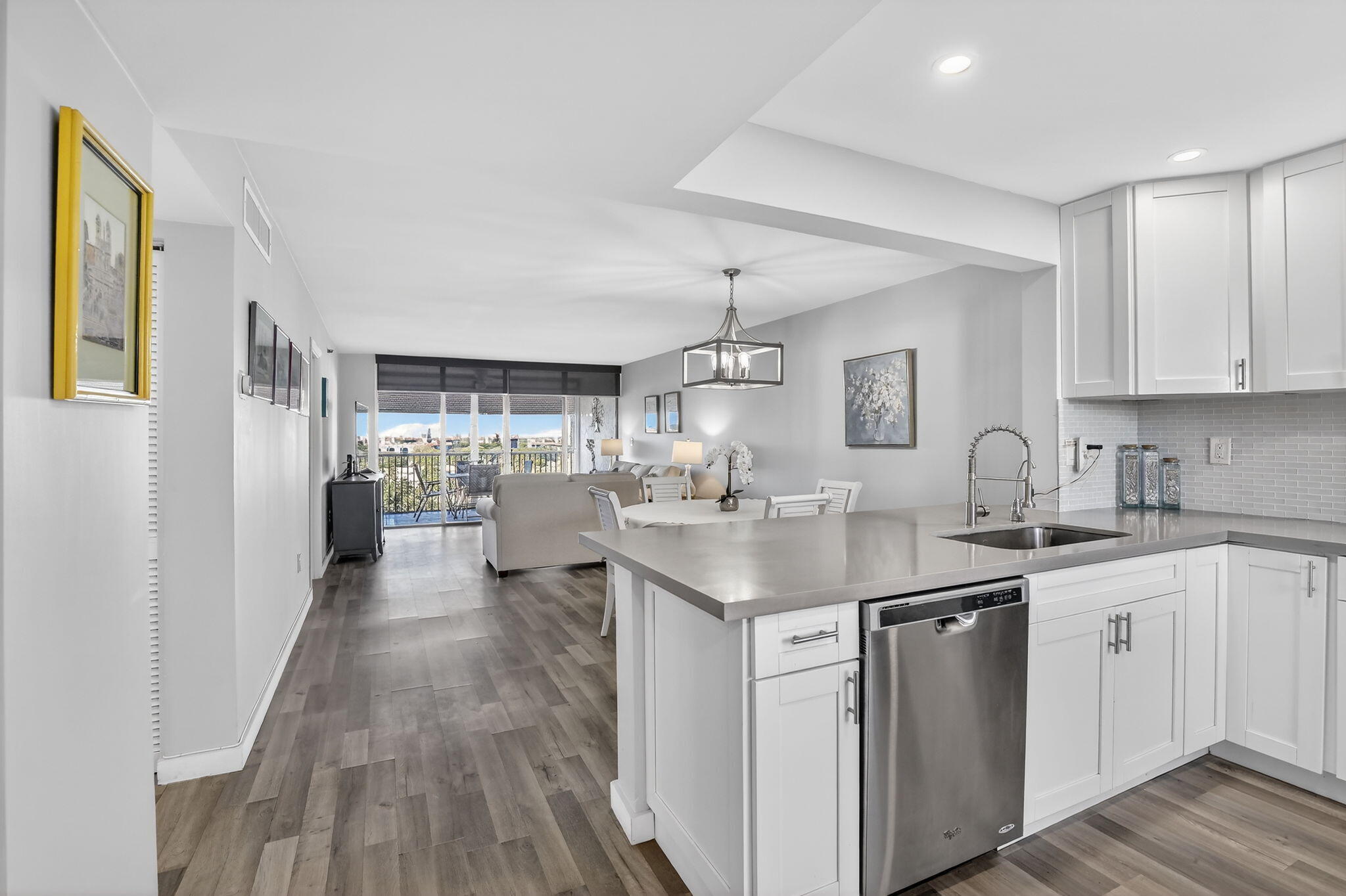 3910 Inverrary Boulevard, Unit 802B Lauderhill, FL 33319 - Photo 2 of 36 a kitchen with counter top space sink and wooden floor