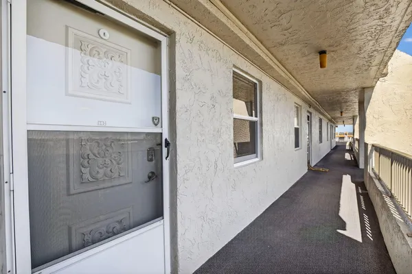 a view of a hallway with staircase