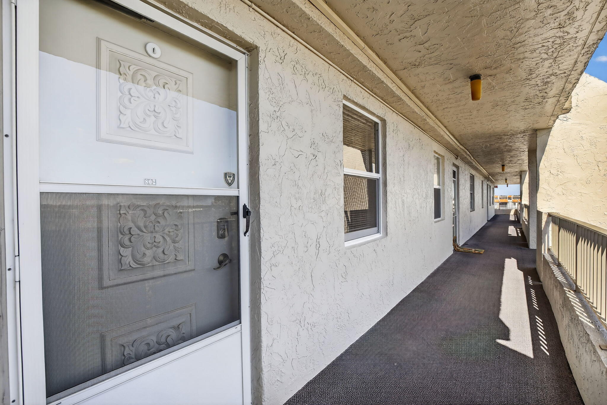 3910 Inverrary Boulevard, Unit 802B Lauderhill, FL 33319 - Photo 27 of 36 a view of a hallway with staircase