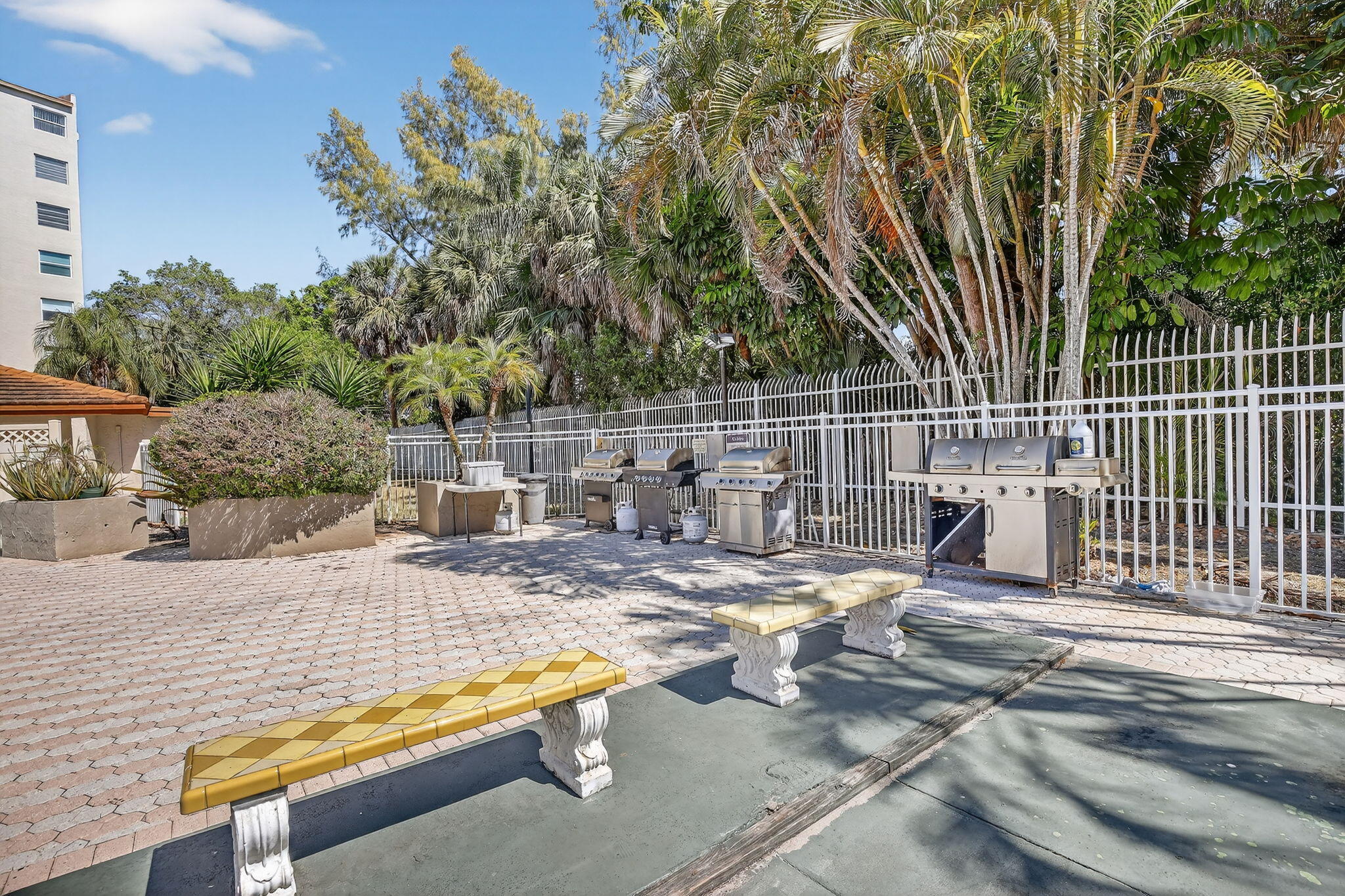 3910 Inverrary Boulevard, Unit 802B Lauderhill, FL 33319 - Photo 35 of 36 a view of backyard with swimming pool and seating