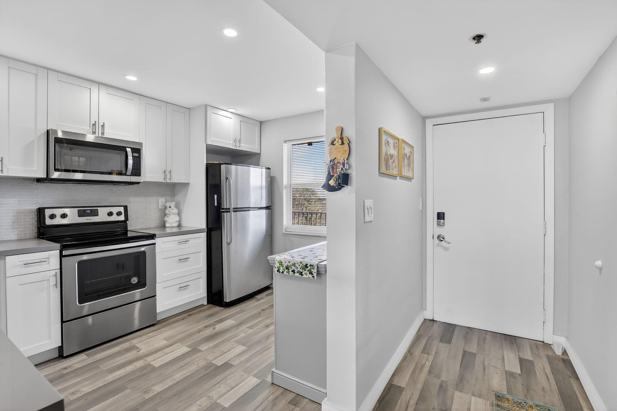3910 Inverrary Boulevard, Unit 802B Lauderhill, FL 33319 - Photo 5 of 36 a kitchen with a refrigerator stove and microwave