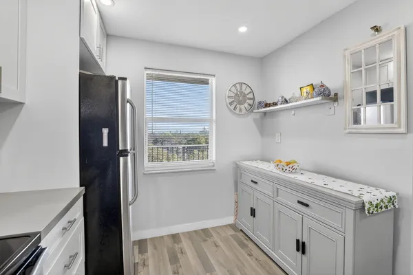 a view of cabinets with wooden floor