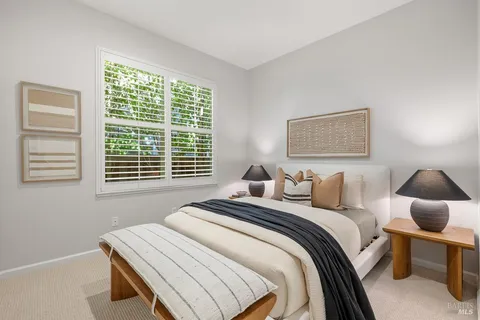a bedroom with a bed and a table