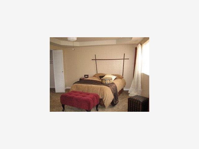 2650 Edison Street San Mateo, CA 94403 - Photo 4 of 9 a bedroom with a bed and a mirror