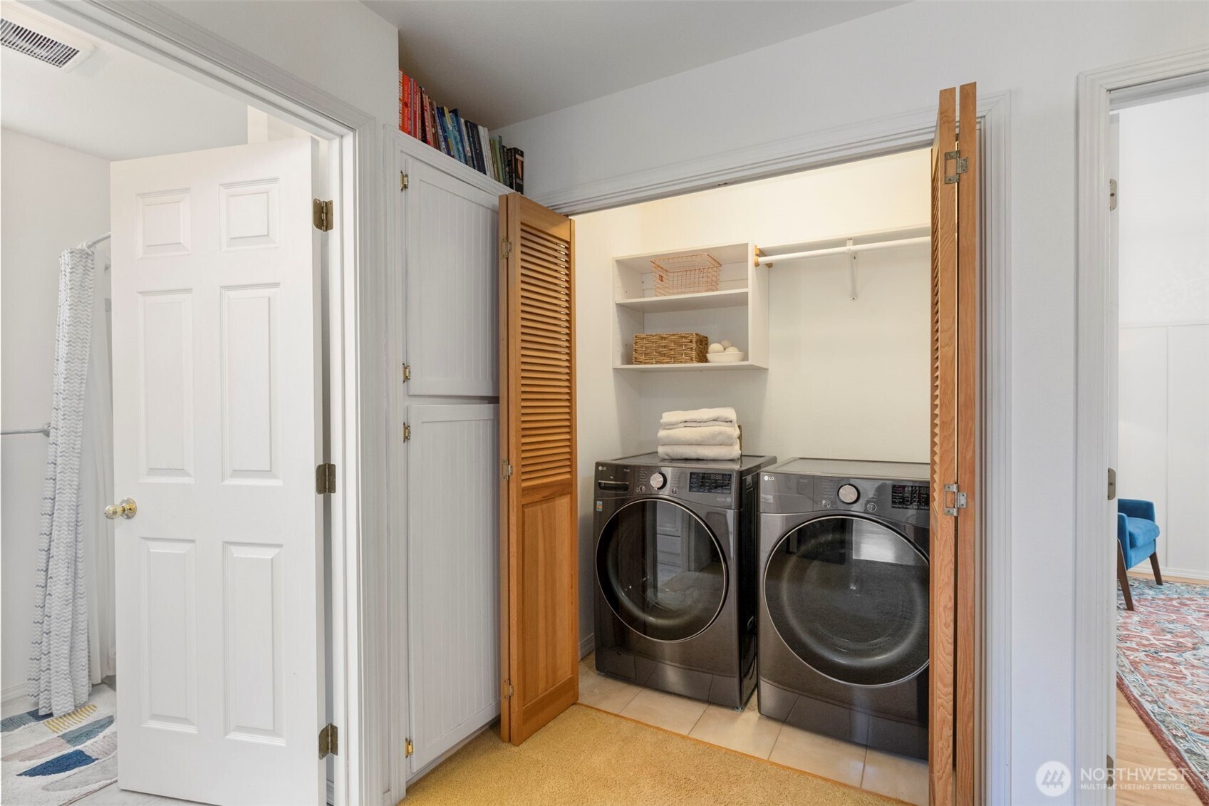 4375 Erin Street Port Townsend, WA 98368 - Photo 14 of 40 a utility room with cabinets dryer and washer