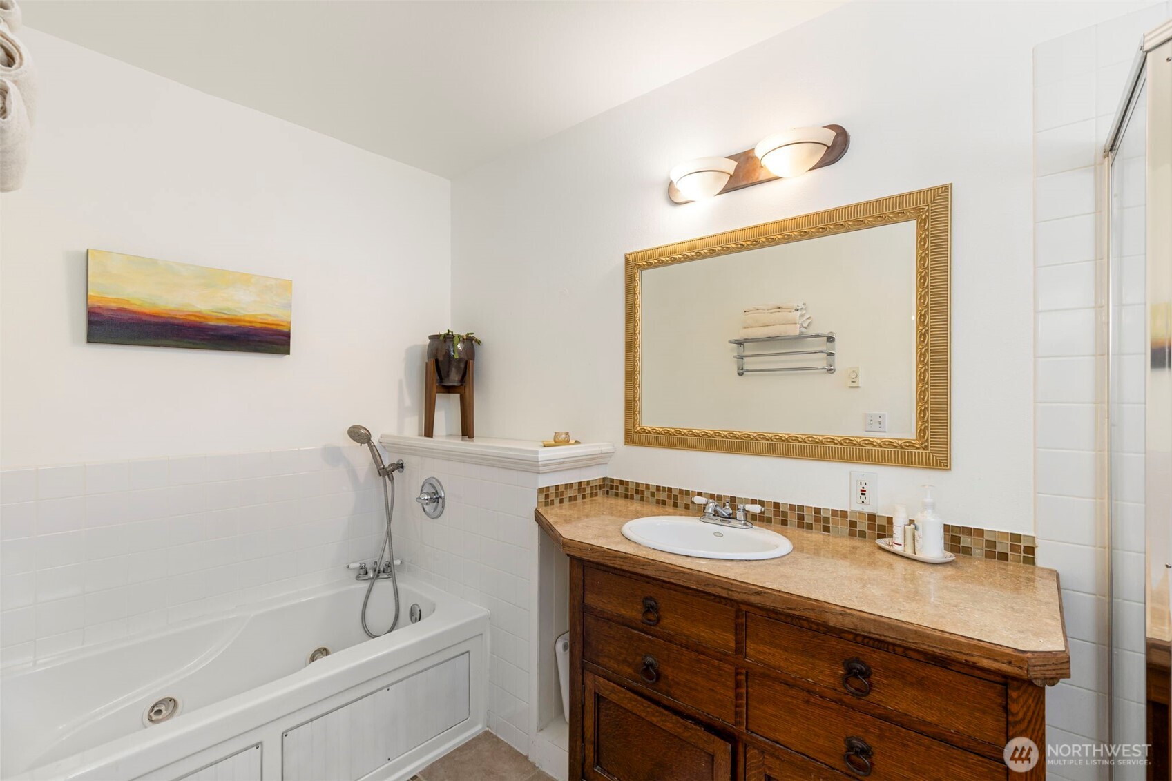 4375 Erin Street Port Townsend, WA 98368 - Photo 17 of 40 a bathroom with a sink mirror and a bathtub