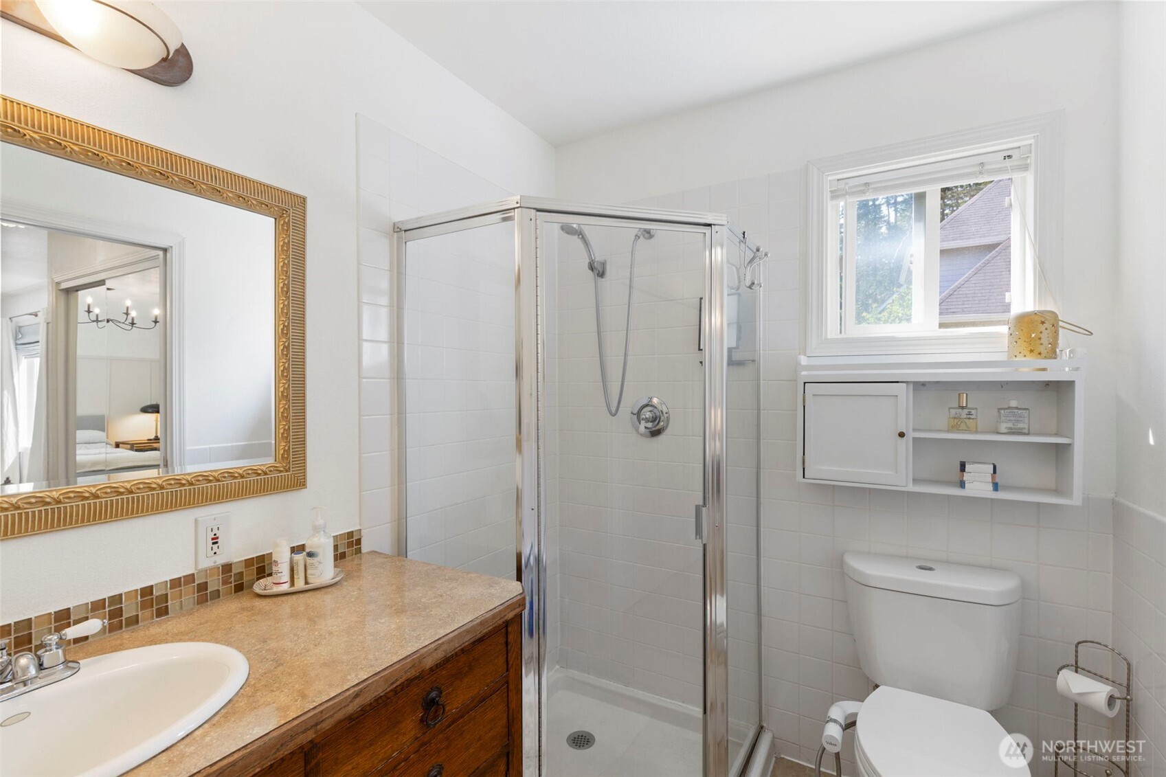 4375 Erin Street Port Townsend, WA 98368 - Photo 18 of 40 a bathroom with a granite countertop toilet sink shower and mirror