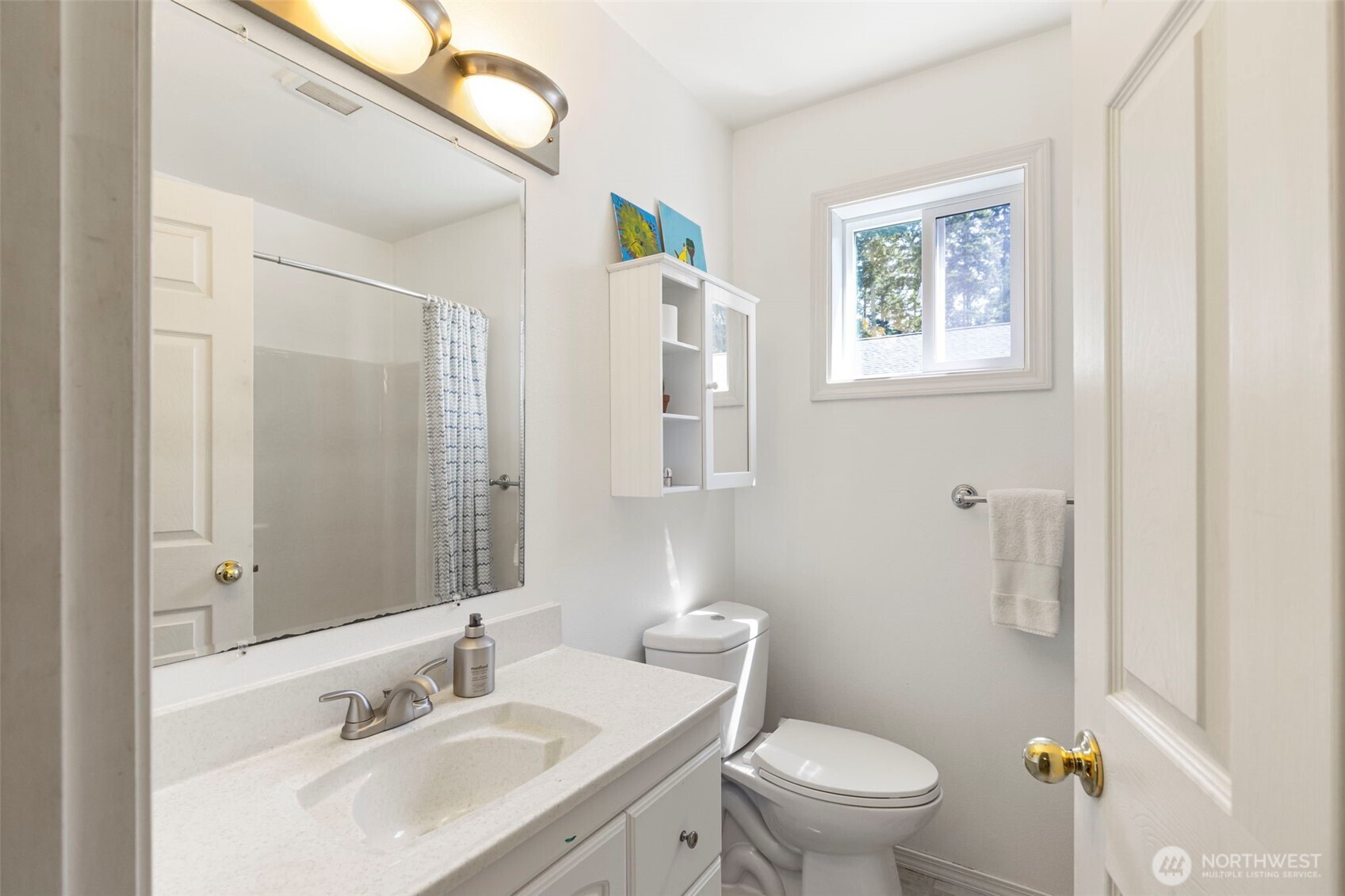 4375 Erin Street Port Townsend, WA 98368 - Photo 22 of 40 a bathroom with a sink toilet and a mirror