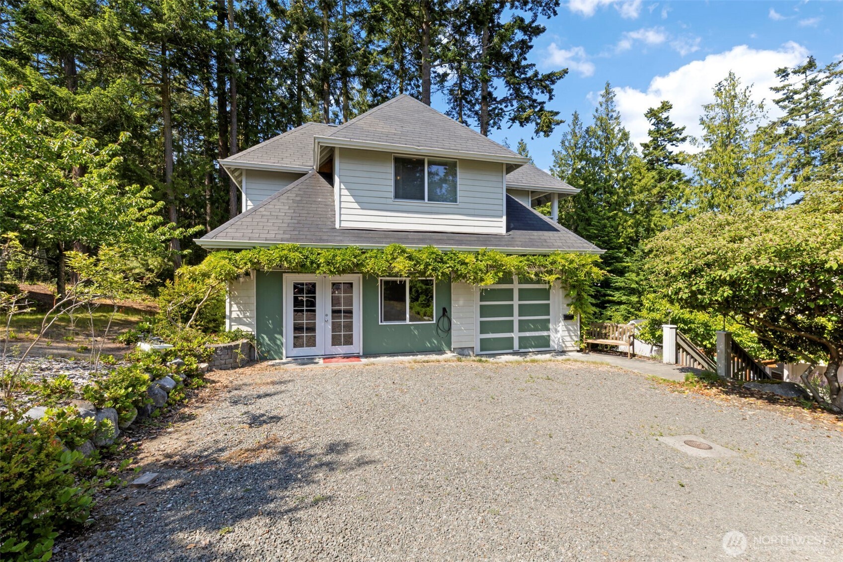 4375 Erin Street Port Townsend, WA 98368 - Photo 25 of 40 a front view of a house with a garden