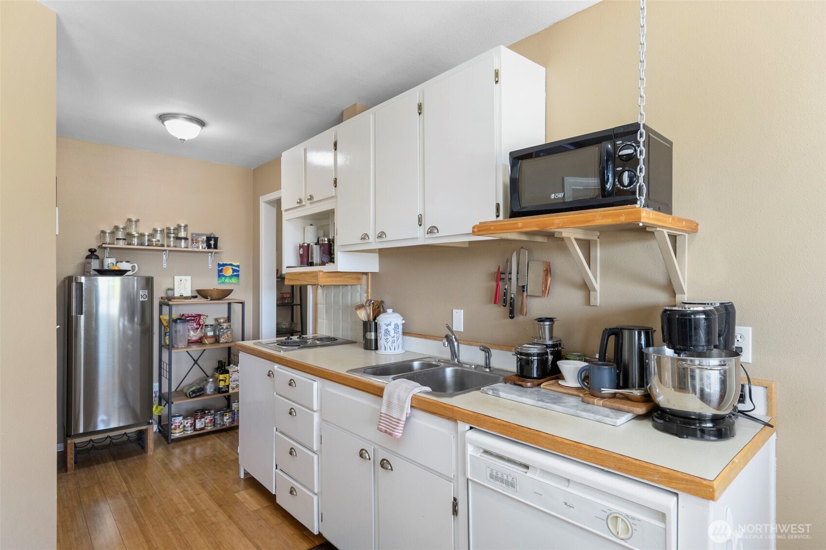 4375 Erin Street Port Townsend, WA 98368 - Photo 29 of 40 a kitchen with stainless steel appliances granite countertop a refrigerator sink and microwave