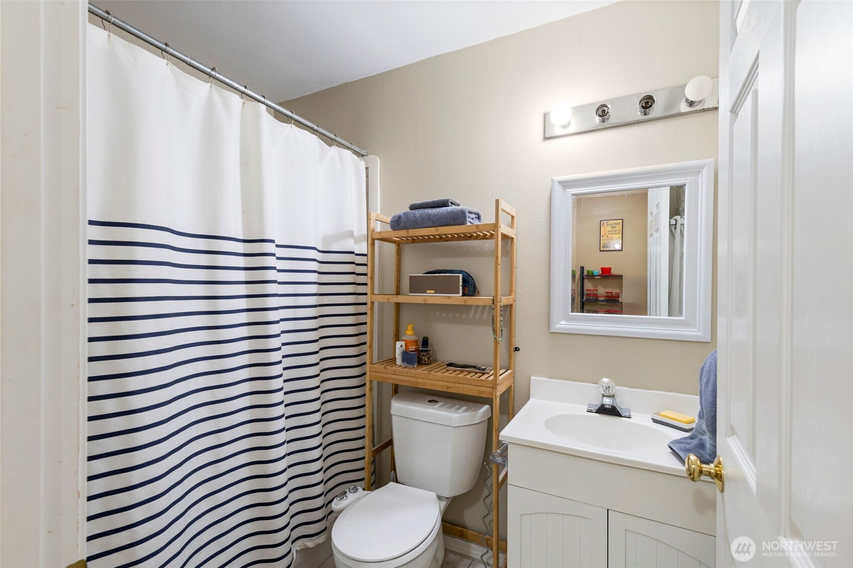 4375 Erin Street Port Townsend, WA 98368 - Photo 31 of 40 a bathroom with a sink a toilet and mirror