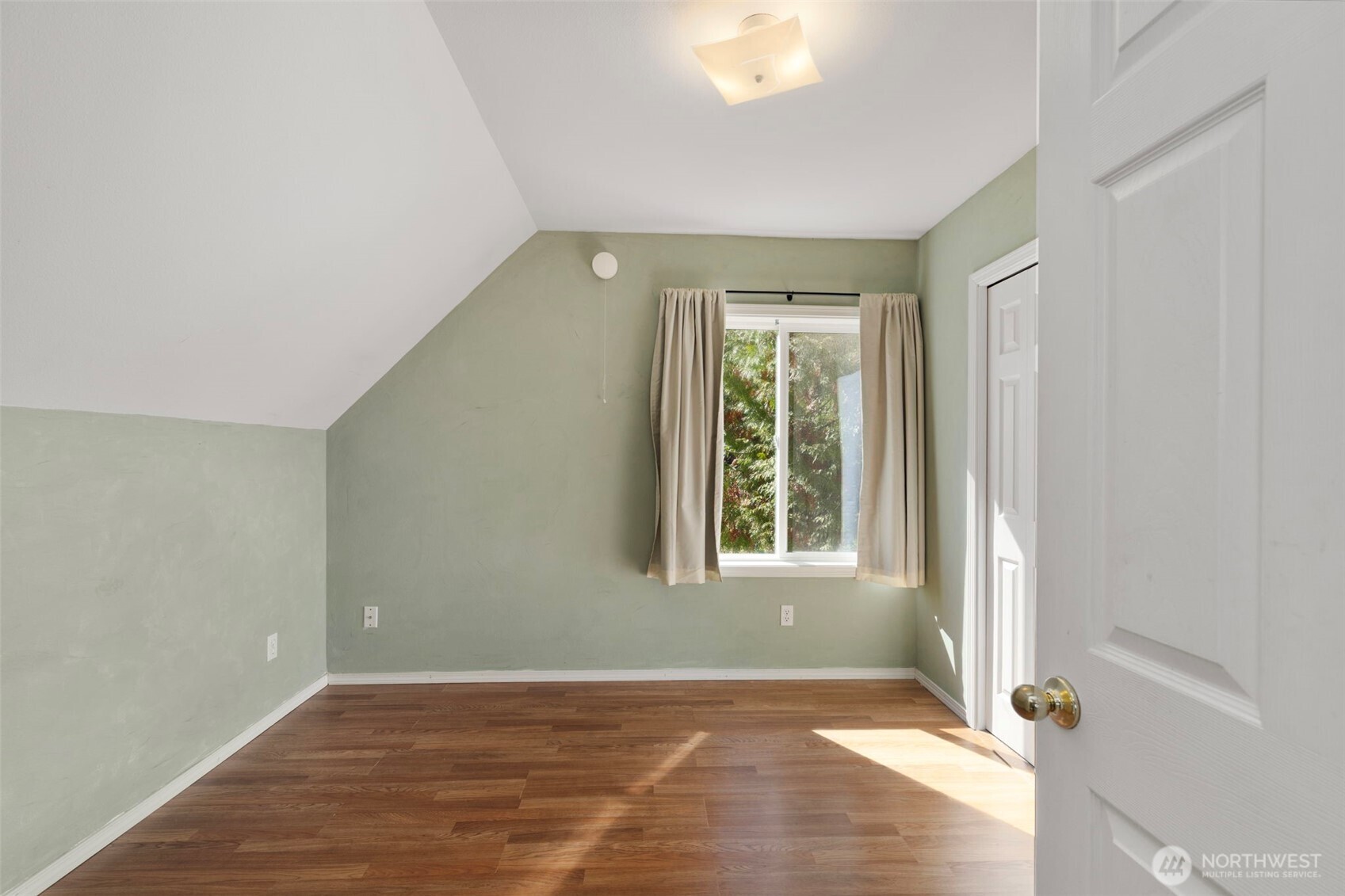4375 Erin Street Port Townsend, WA 98368 - Photo 38 of 40 a view of an empty room with wooden floor and a window