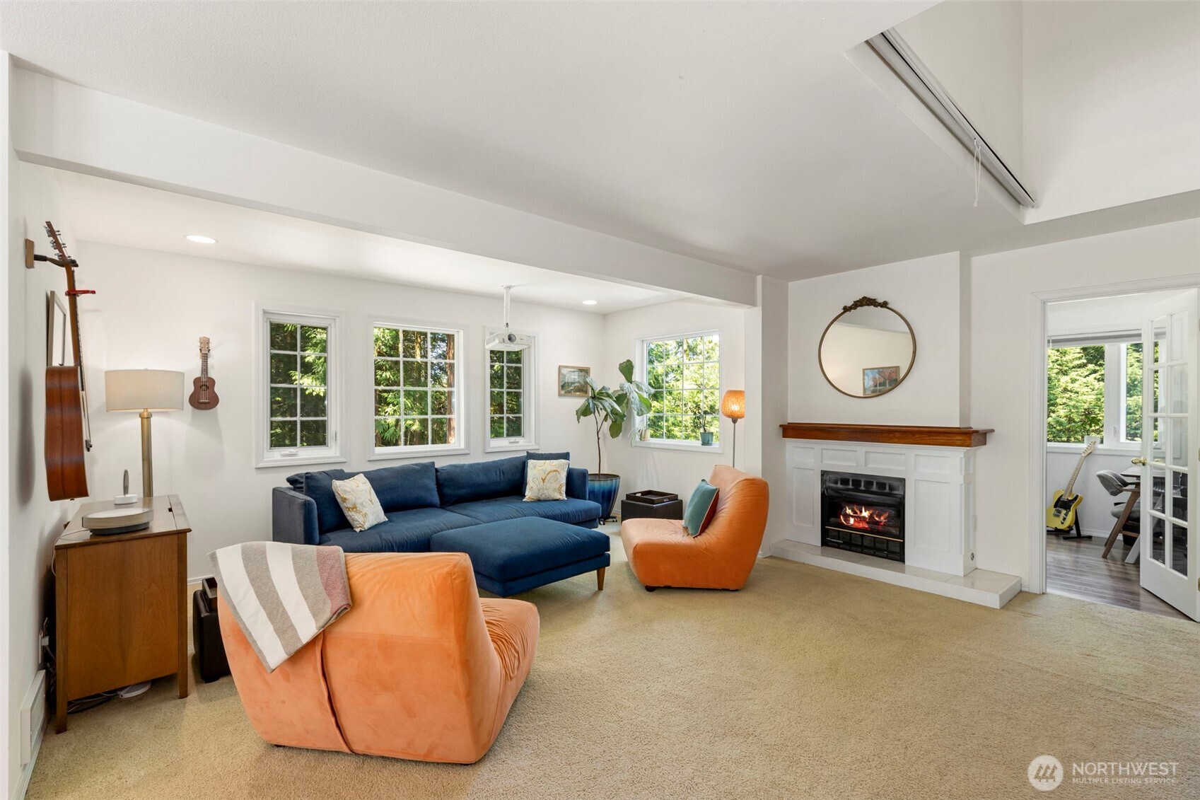 4375 Erin Street Port Townsend, WA 98368 - Photo 4 of 40 a living room with furniture a fireplace and a window