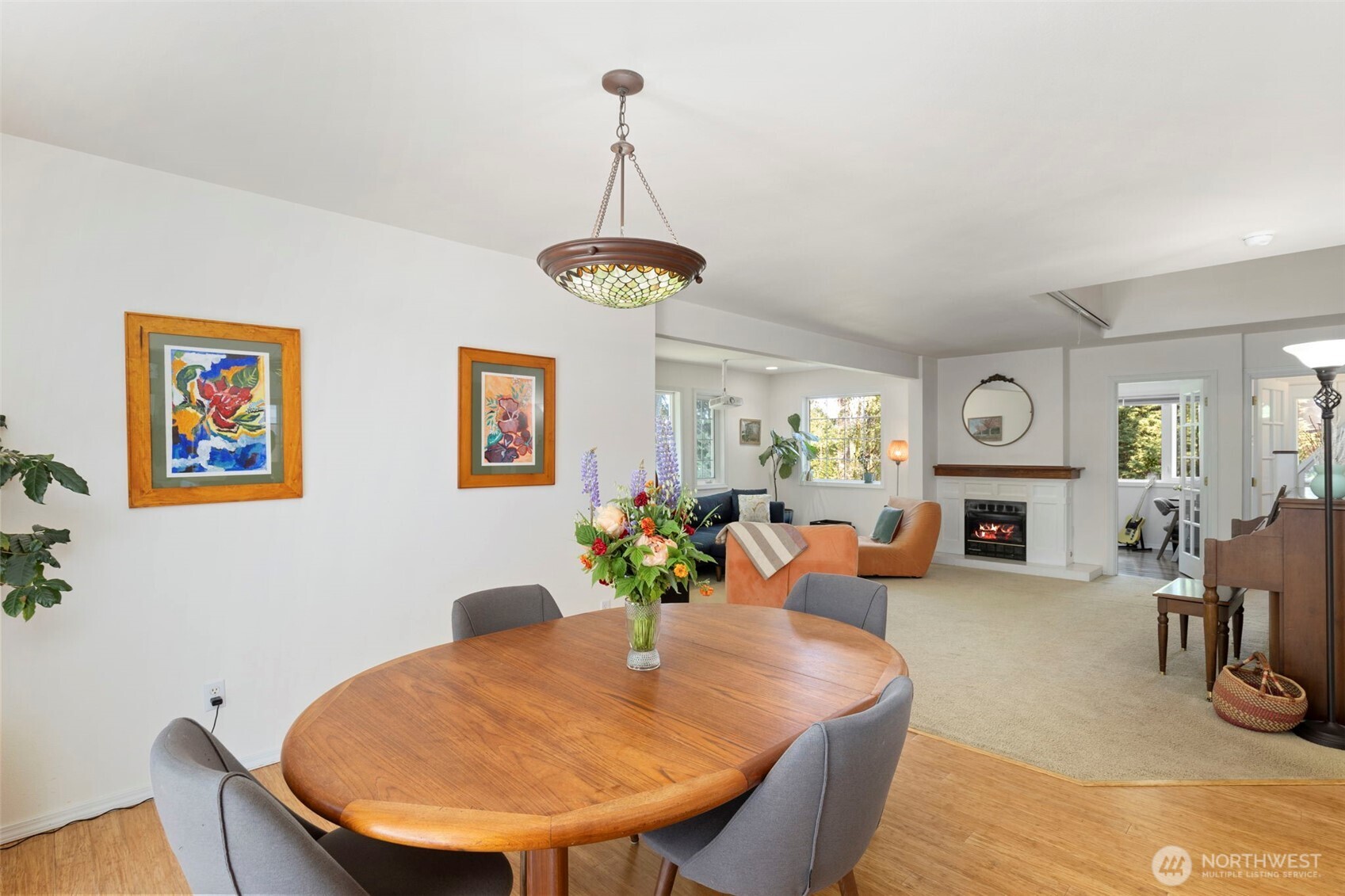 4375 Erin Street Port Townsend, WA 98368 - Photo 7 of 40 a view of a dining room with furniture a fireplace and chandelier
