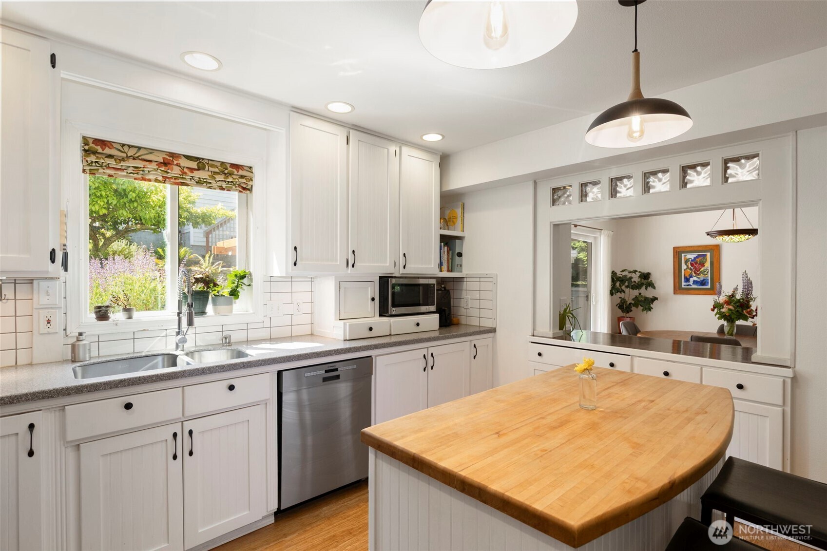 4375 Erin Street Port Townsend, WA 98368 - Photo 9 of 40 a kitchen with stainless steel appliances granite countertop a sink a stove and a refrigerator
