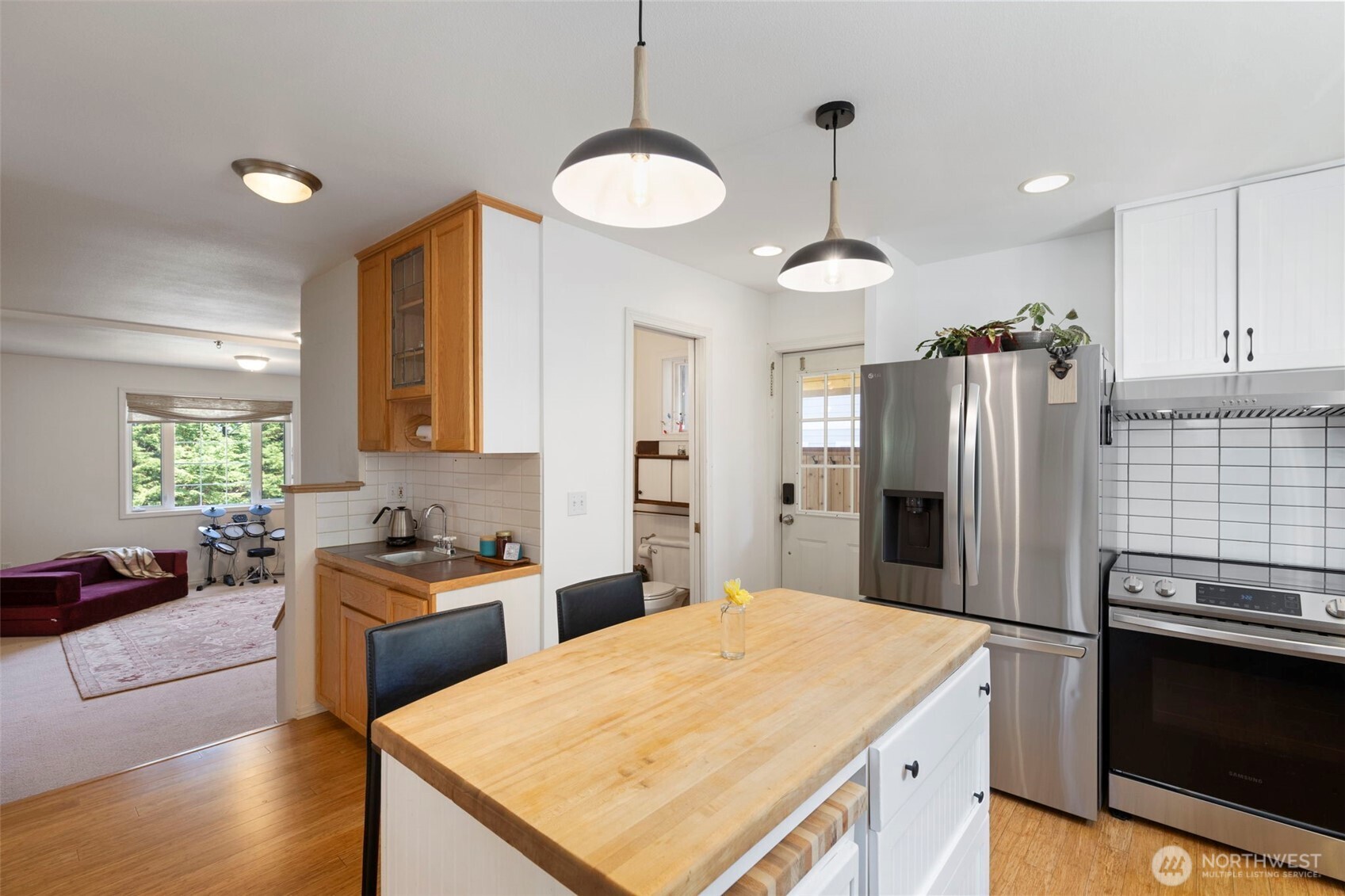4375 Erin Street Port Townsend, WA 98368 - Photo 10 of 40 a kitchen with stainless steel appliances granite countertop a sink stove and refrigerator