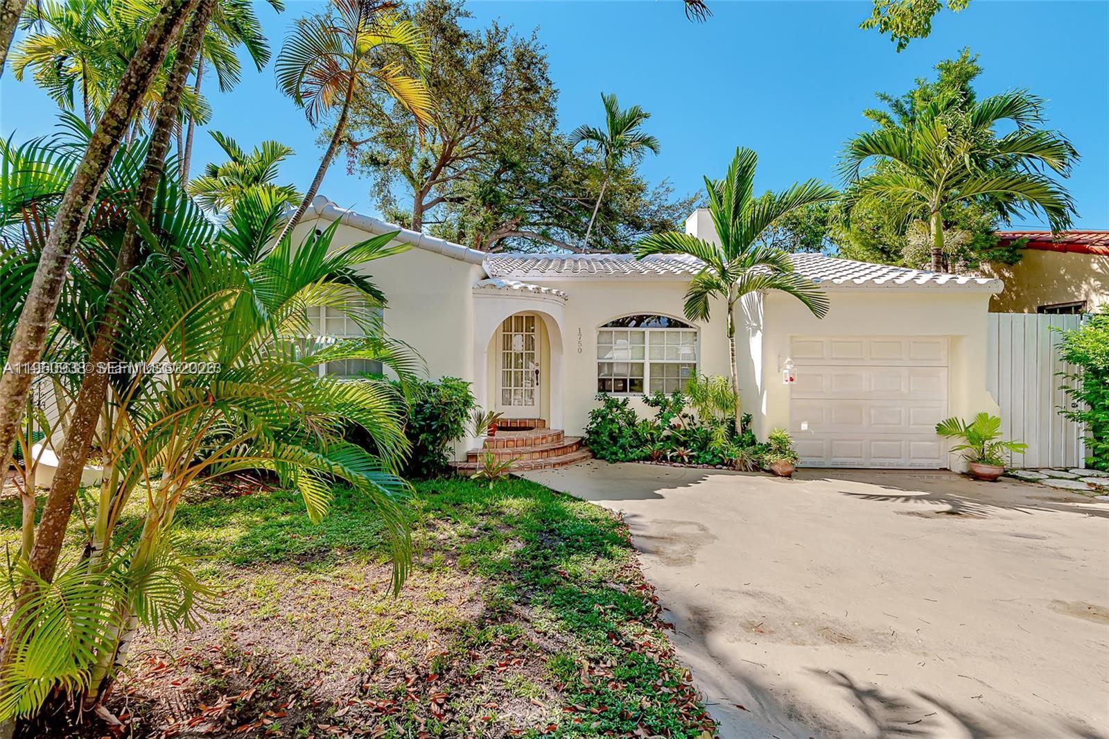 1750 Southwest 16th Street, Unit 1 Miami, FL 33145 - Photo 7 of 7 a front view of a house with a garden
