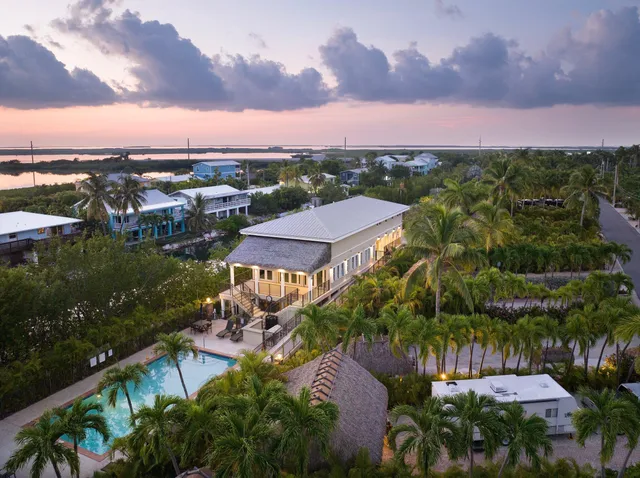 a kitchen with stainless steel appliances granite countertop a refrigerator and a stove