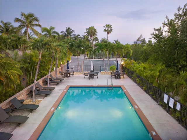 a view of swimming pool with chairs