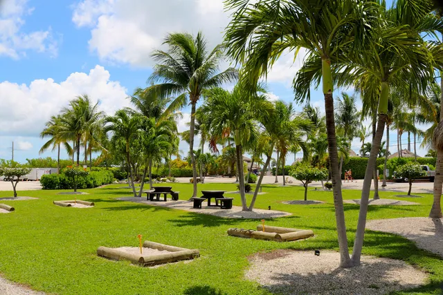 a view of car parked on the side of a street