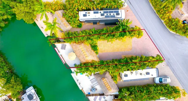 a view of house with swimming pool yard and outdoor seating
