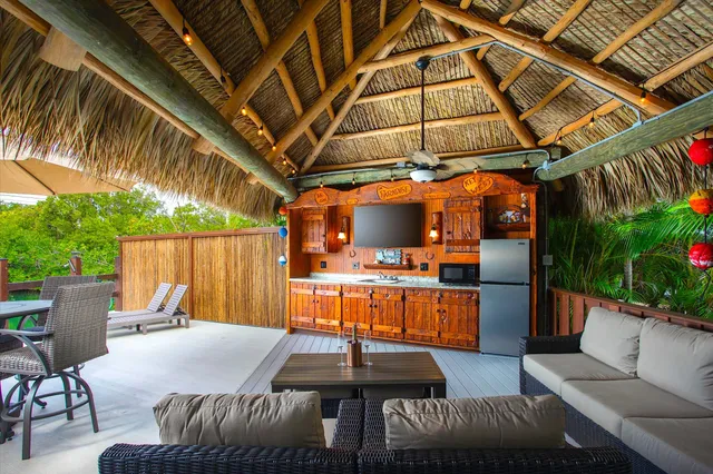 a view of a backyard with sitting area