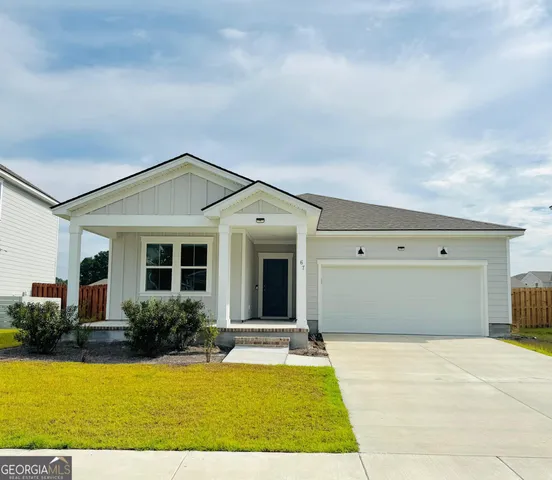 a front view of a house with yard