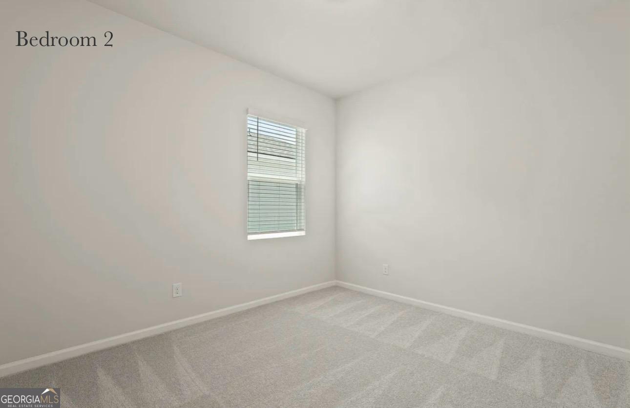 67 Shade Tree Drive Richmond Hill, GA 31324 - Photo 13 of 25 an empty room with a window