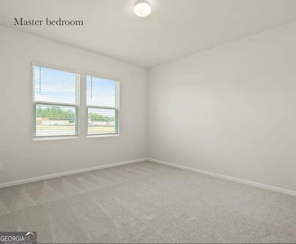 67 Shade Tree Drive Richmond Hill, GA 31324 - Photo 14 of 25 an empty room with a window