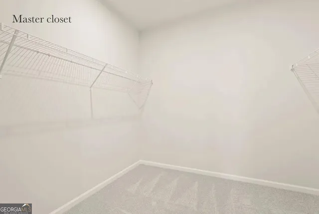 a bathroom with a toilet a sink a mirror and a shower